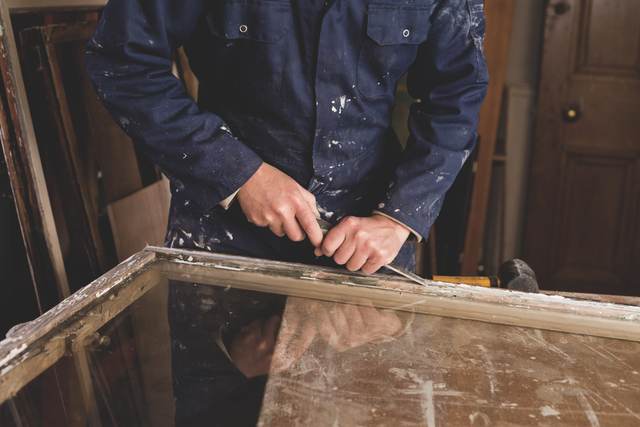 Sash window repair work on the bench in a London workshop